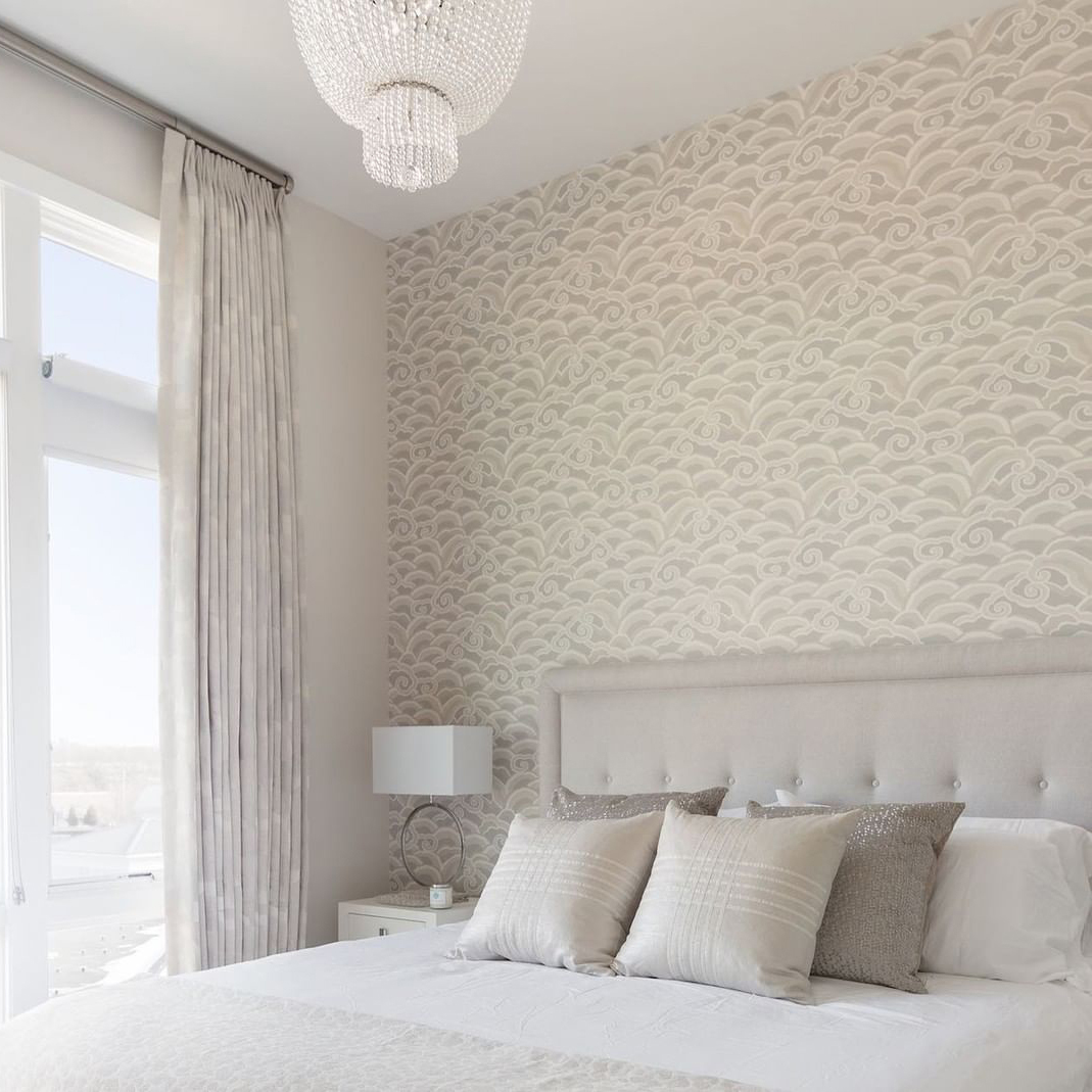 The inclusion of this platinum wave wallpaper adds a playful yet elegant touch to this bedroom